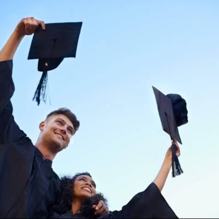 graduation-day-outdoors-shot-of-students-celebrating-on-graduation-day-2PTANM3-transformed